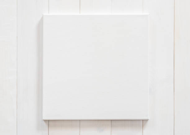White canvas frame mock up template square size on white wood wall for arts painting and photo hanging interior decoration