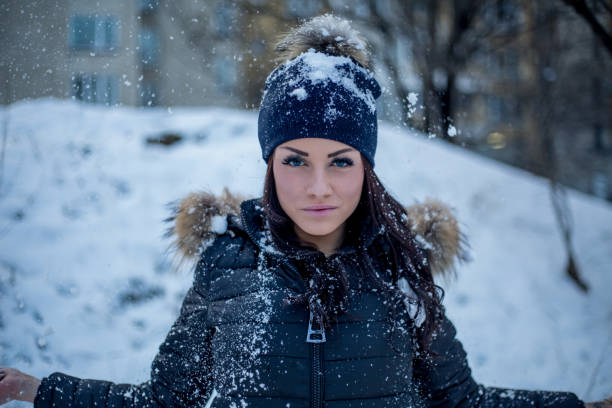 istock Beautiful woman posing in winter park 1041140438