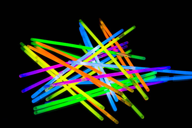istock Colorful fluorescent light neon big glow stick on mirror reflection black background 1041143578