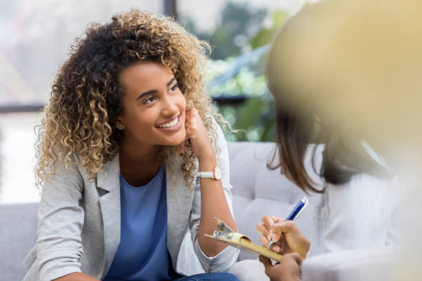 istock Cheerful woman discusses success during therapy 1041145200