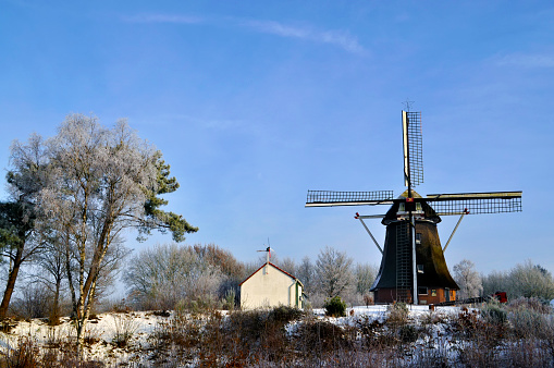 Old Dutch windmill on a winter's day with snow, frozen trees and a blue sky\n[url=file_closeup.php?id=11599167][img]file_thumbview_approve.php?size=1&id=11599167[/img][/url] [url=file_closeup.php?id=11596271][img]file_thumbview_approve.php?size=1&id=11596271[/img][/url] [url=file_closeup.php?id=11596238][img]file_thumbview_approve.php?size=1&id=11596238[/img][/url]\n\n[url=http://www.istockphoto.com/search/lightbox/7874292][img]http://www.sjo.nl/istockphoto_banners/Architecture.jpg[/img][/url]\n[url=http://www.istockphoto.com/search/lightbox/7691646][img]http://www.sjo.nl/istockphoto_banners/Winter.jpg[/img][/url]\n[url=http://www.istockphoto.com/search/lightbox/1904385][img]http://www.sjo.nl/istockphoto_banners/IndustrialEnergy.jpg[/img][/url]\n[url=http://www.istockphoto.com/search/lightbox/9395645][img]http://www.sjo.nl/istockphoto_banners/Netherlands.jpg[/img][/url] [url=http://www.istockphoto.com/search/lightbox/12643399][img]http://www.sjo.nl/istockphoto_banners/Agriculture.jpg[/img][/url]