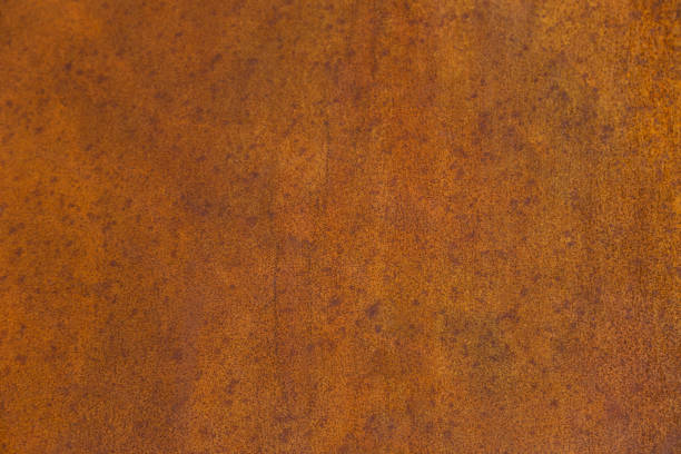 Fragment of old rusty unpainted metal surface. Textured background. Close shot.