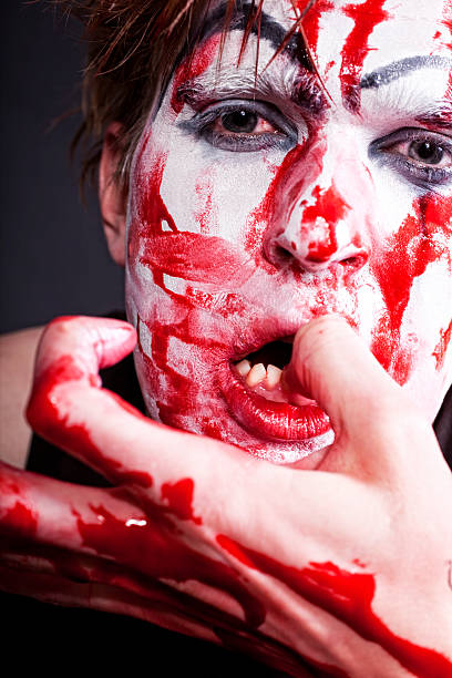 istock mime with blood on face and hand 104114827