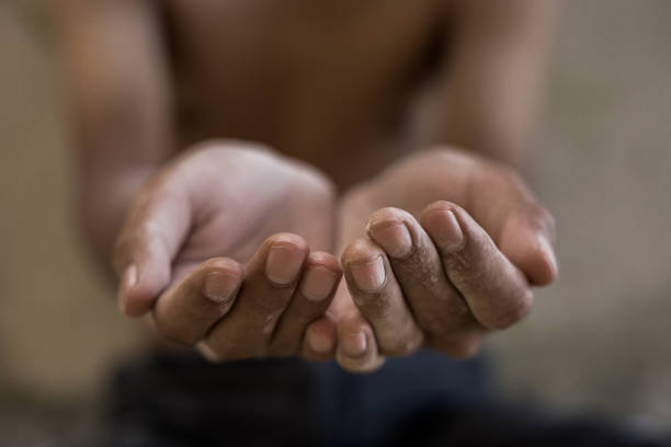 istock hands of hunger child 1041148700