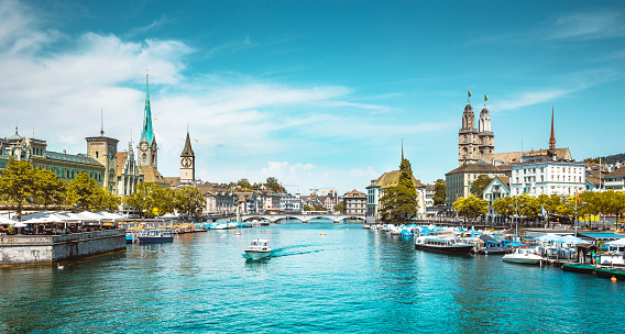 Panoramic view of historic Zurich city center with famous river Limmat at Lake Zurich on a sunny day with clouds in summer, Switzerland