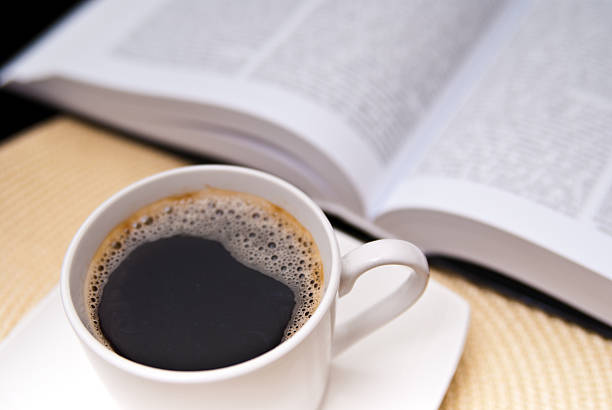 istock cup of coffee and opened book 104115209
