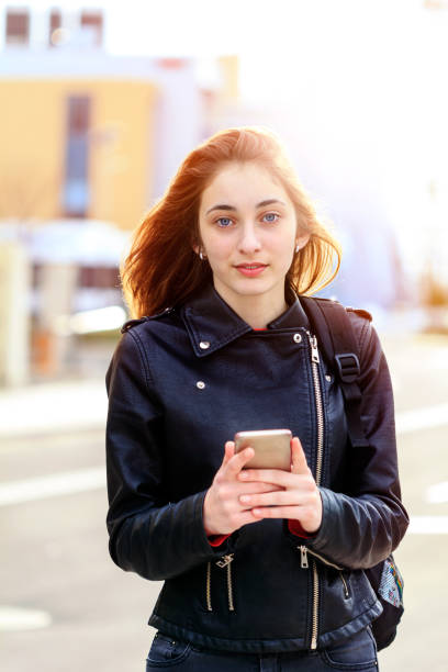 istock Young beautiful girl is using her  phone. 1041153712