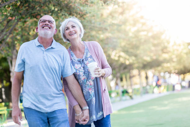 istock Loving couple stroll through park 1041153908
