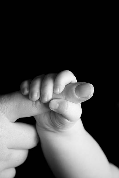 istock Babies hand gripping mothers finger 104115567