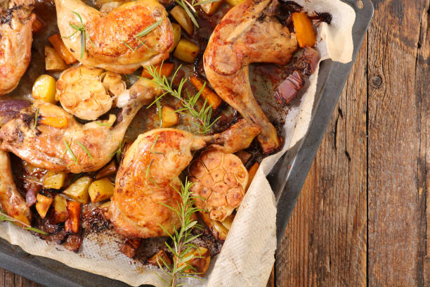 istock baked chicken leg and vegetable 1041157152
