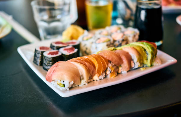 Rainbow sushi roll on table in restaurant