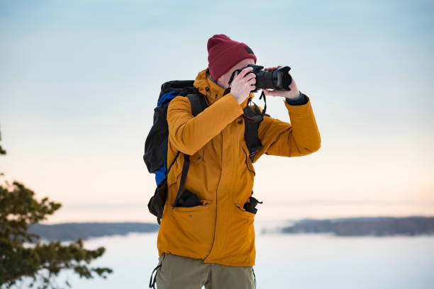 istock Mature traveler with camera exploring Finland 1041159152