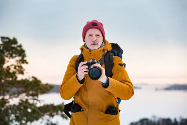 istock Mature traveler with camera exploring Finland 1041163498