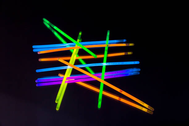 istock Colorful fluorescent light neon big glow stick on mirror reflection black background 1041163886