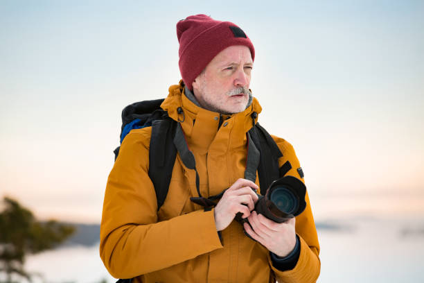 istock Mature traveler with camera exploring Finland 1041164088