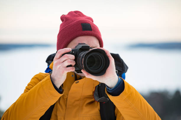 istock Mature traveler with camera exploring Finland 1041164156