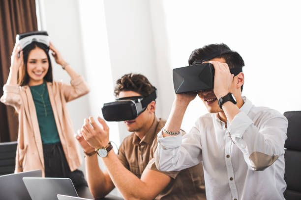 istock two smiling businessmen using virtual reality headsets at modern office 1041164184
