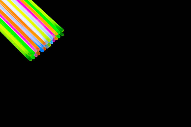 istock Colorful fluorescent light neon big glow stick on mirror reflection black background 1041165224
