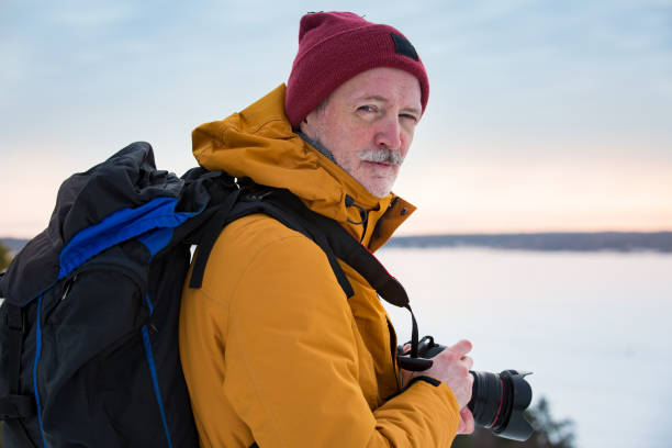 istock Mature traveler with camera exploring Finland 1041165378