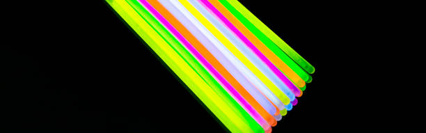 istock Colorful fluorescent light neon big glow stick on mirror reflection black background 1041165950