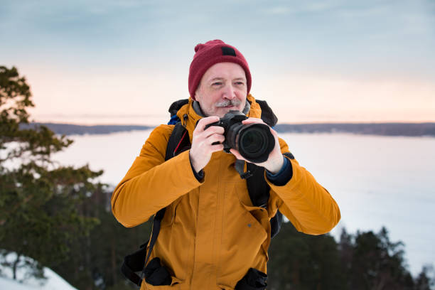 istock Mature traveler with camera exploring Finland 1041166120