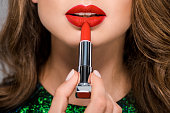 cropped shot of woman with red lipstick isolated on grey