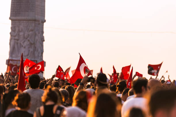 September 9 Independence day of Izmir. Crowded people in the square of Gundogdu and a Turkish flag in crowded people.