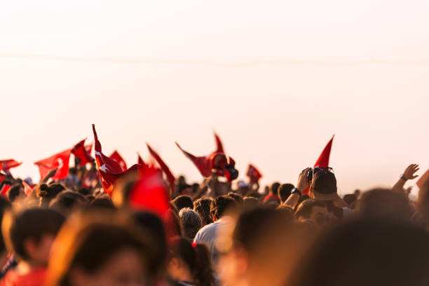 istock Turkish flag in crowded people. 1041166398