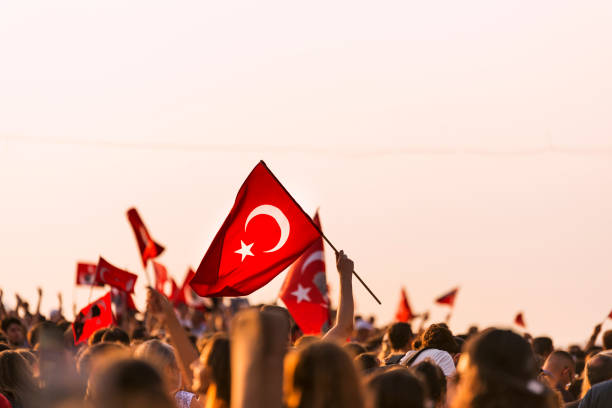 Turkish flag in crowded people. September 9 Independence day of Izmir. Crowded people in the square of Gundogdu and a Turkish flag in crowded people. aegean turkey photos stock pictures, royalty-free photos & images