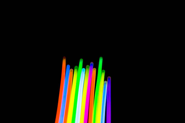 istock Colorful fluorescent light neon big glow stick on mirror reflection black background 1041166440