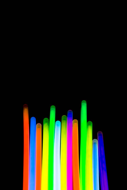 istock Colorful fluorescent light neon big glow stick on mirror reflection black background 1041166698