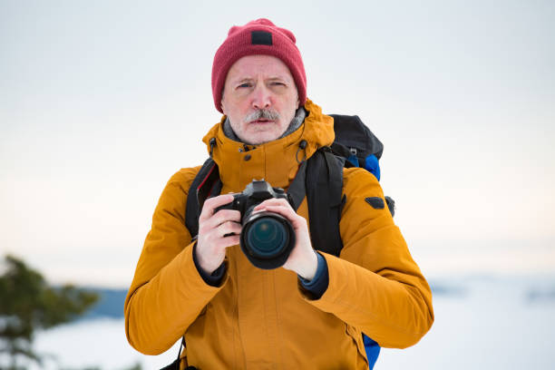 istock Mature traveler with camera exploring Finland 1041166828