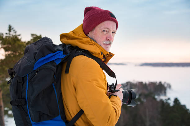istock Mature traveler with camera exploring Finland 1041167378