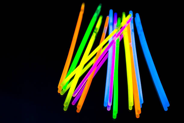 istock Colorful fluorescent light neon big glow stick on mirror reflection black background 1041168310