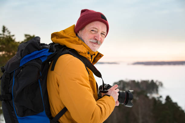 istock Mature traveler with camera exploring Finland 1041168930