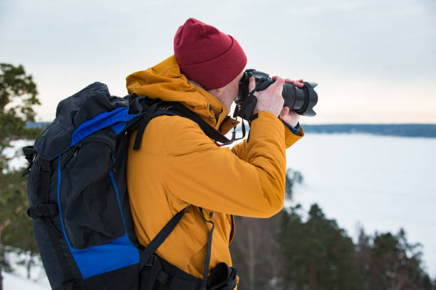 istock Mature traveler with camera exploring Finland 1041168934