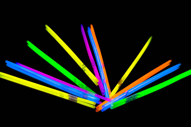 istock Colorful fluorescent light neon big glow stick on mirror reflection black background 1041171896
