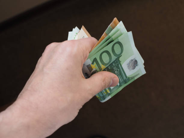 istock Hand with Euro notes, European Union 1041174274