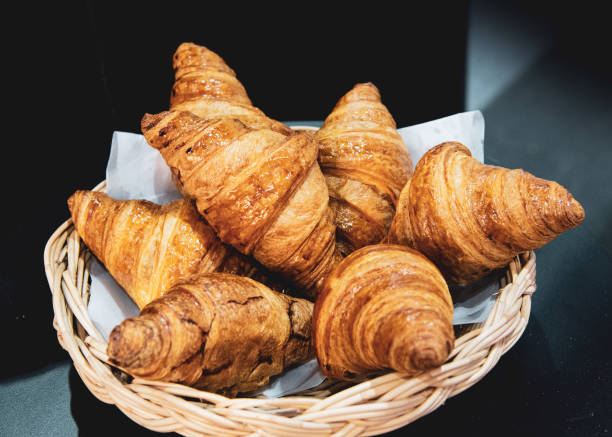 istock French croissants on wicker basket, bakery background 1041175320