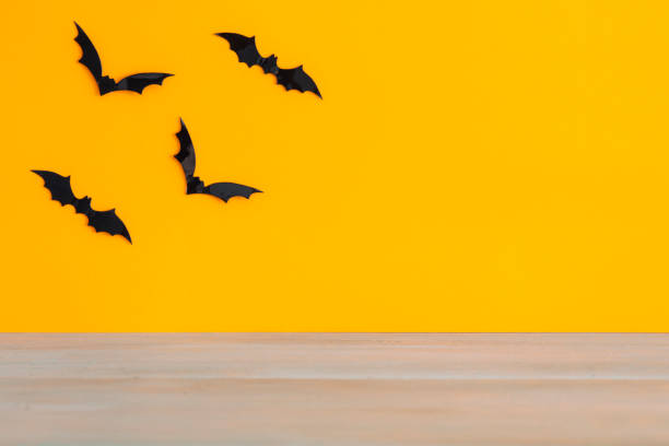 istock Bats with an orange background. Halloween concept. 1041182568
