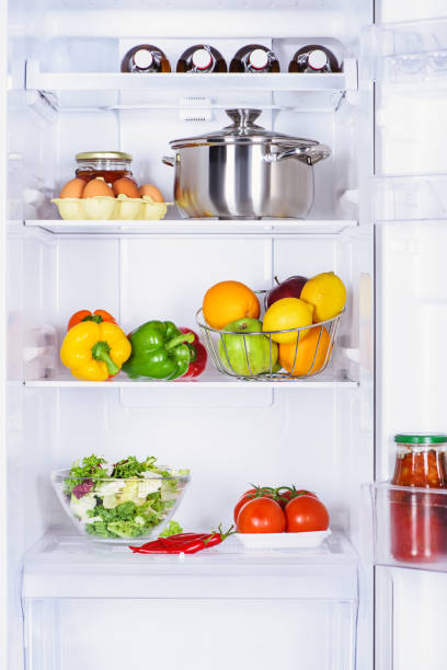 istock fruits, vegetables and pan with eggs in fridge 1041183176