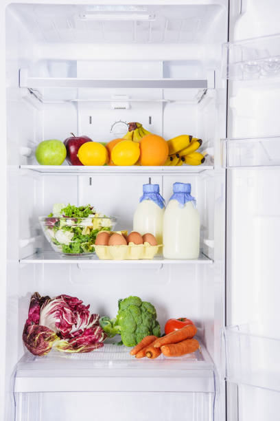 istock fruits, vegetables and milk with eggs in fridge 1041183218