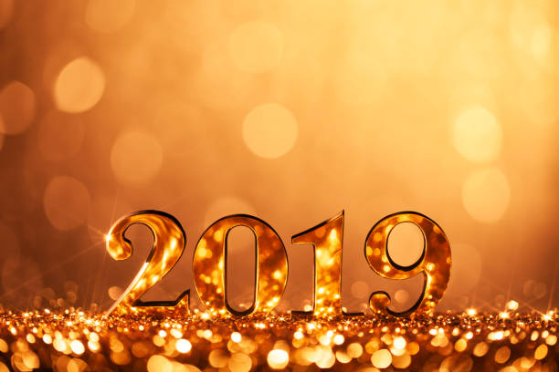 New Year Christmas Decoration 2019 - Gold Party Celebration Golden numbers 2019 and defocused lights. new year 2019 stock pictures, royalty-free photos & images