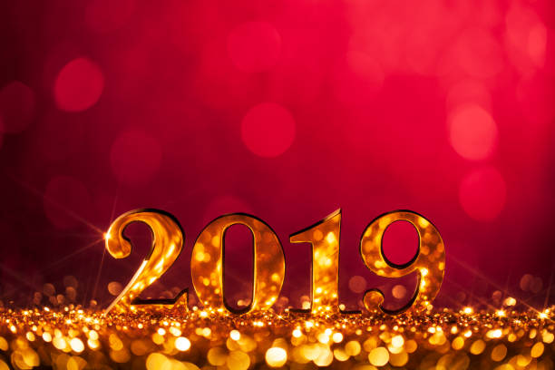 New Year Christmas Decoration 2019 - Gold Red Party Celebration Golden numbers 2019 and defocused lights. new year 2019 stock pictures, royalty-free photos & images