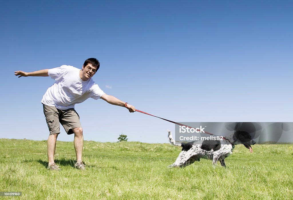 Man playing with his dog  Adult Stock Photo