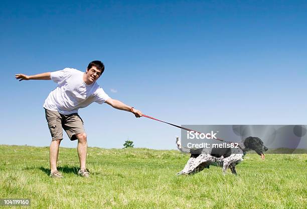 Man Playing With His Dog Stock Photo - Download Image Now - Adult, Adults Only, Agricultural Field