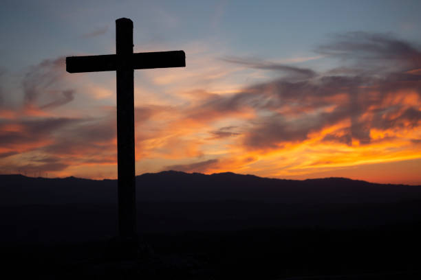 istock Catholic cross fantastic sunset 1041194004