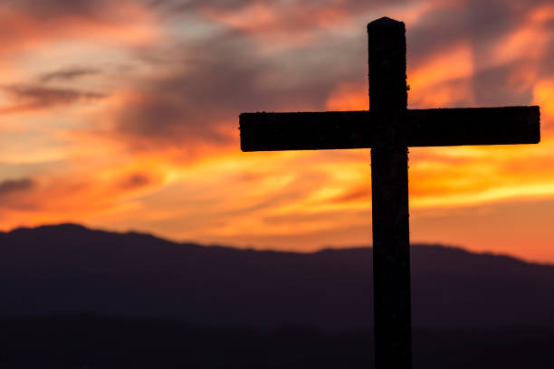 istock Catholic cross fantastic sunset 1041194006