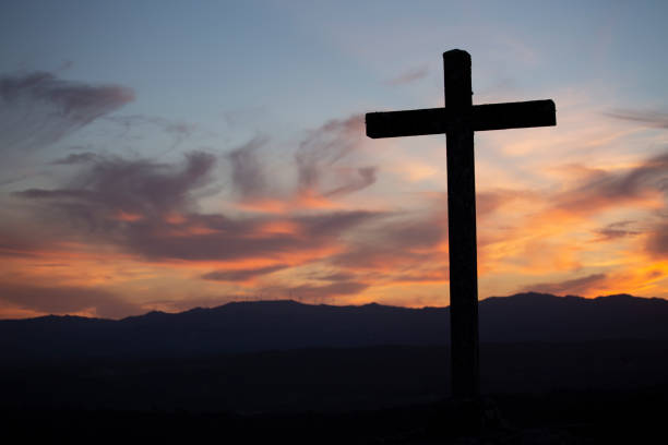 istock Catholic cross fantastic sunset 1041194008