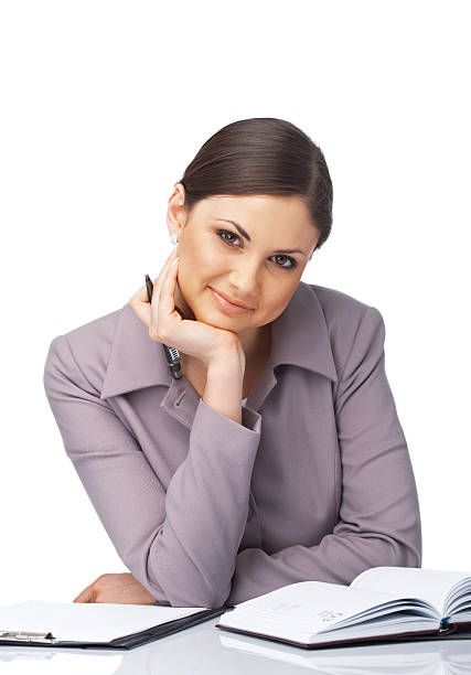 istock Smiling Businesswoman with Hand Under ner Chin 104119878